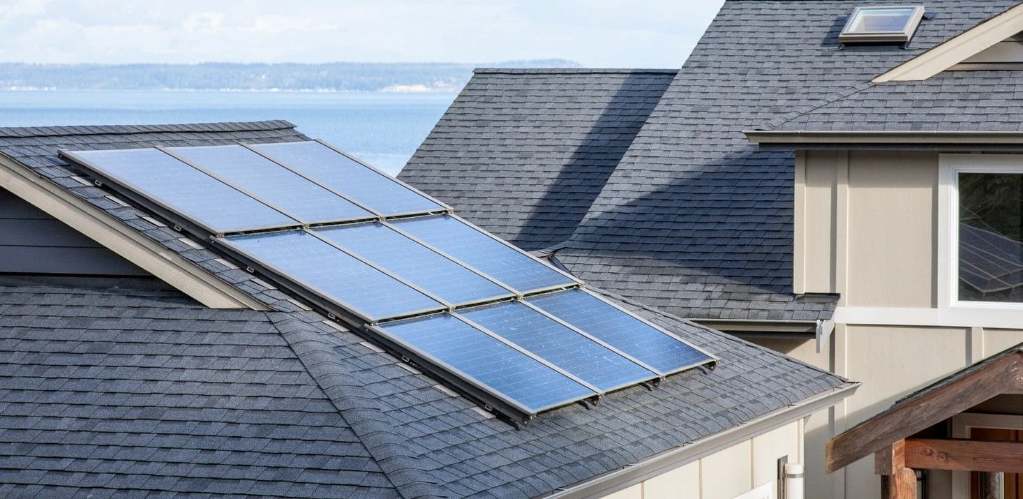 A close up of solar panels on the roof of a house