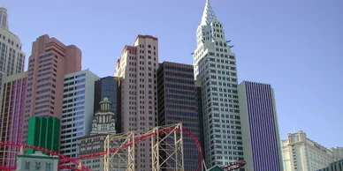 A view of the city skyline with roller coasters.