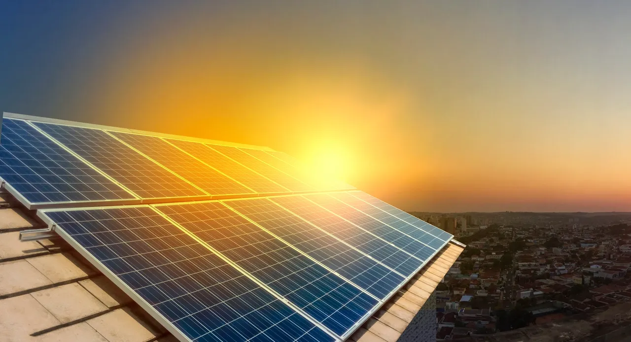 A close up of a solar panel on top of a roof.