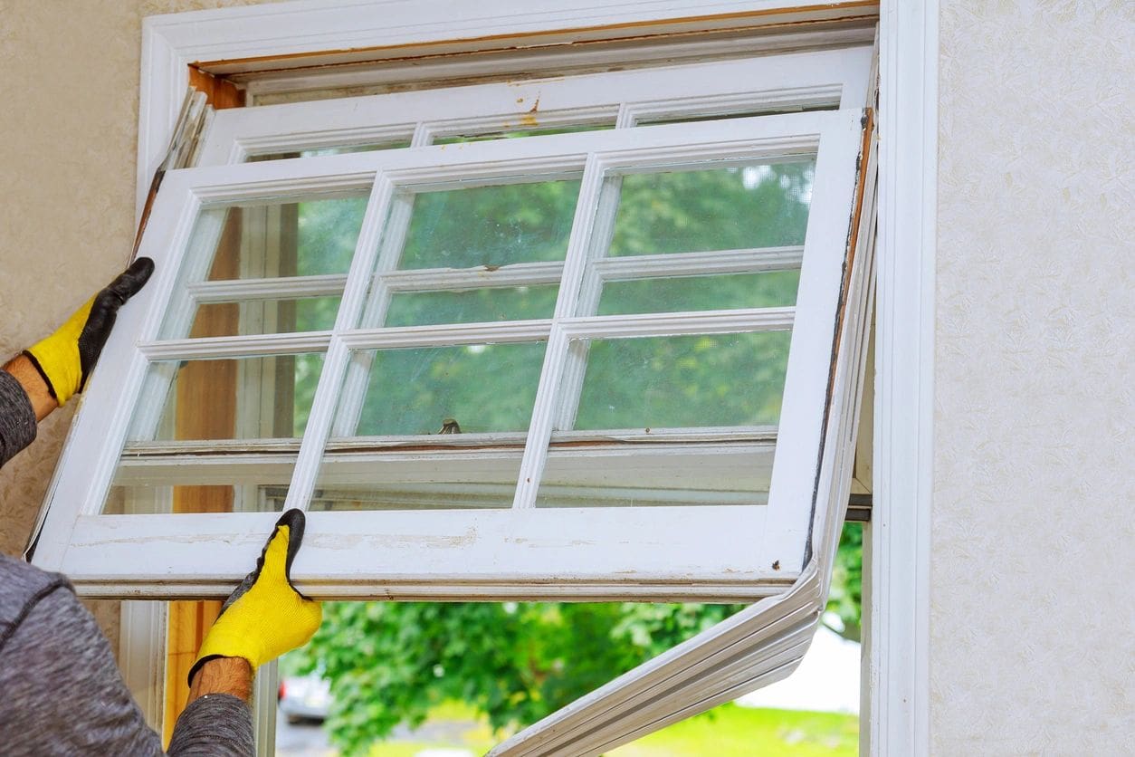 A worker installing a window.