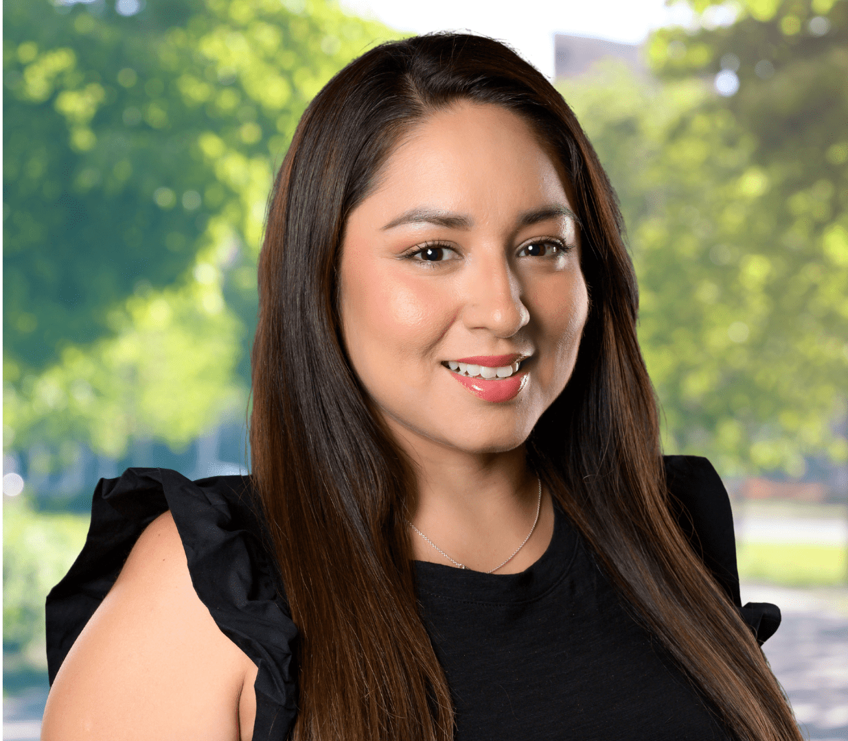 Smiling woman with long brown hair.