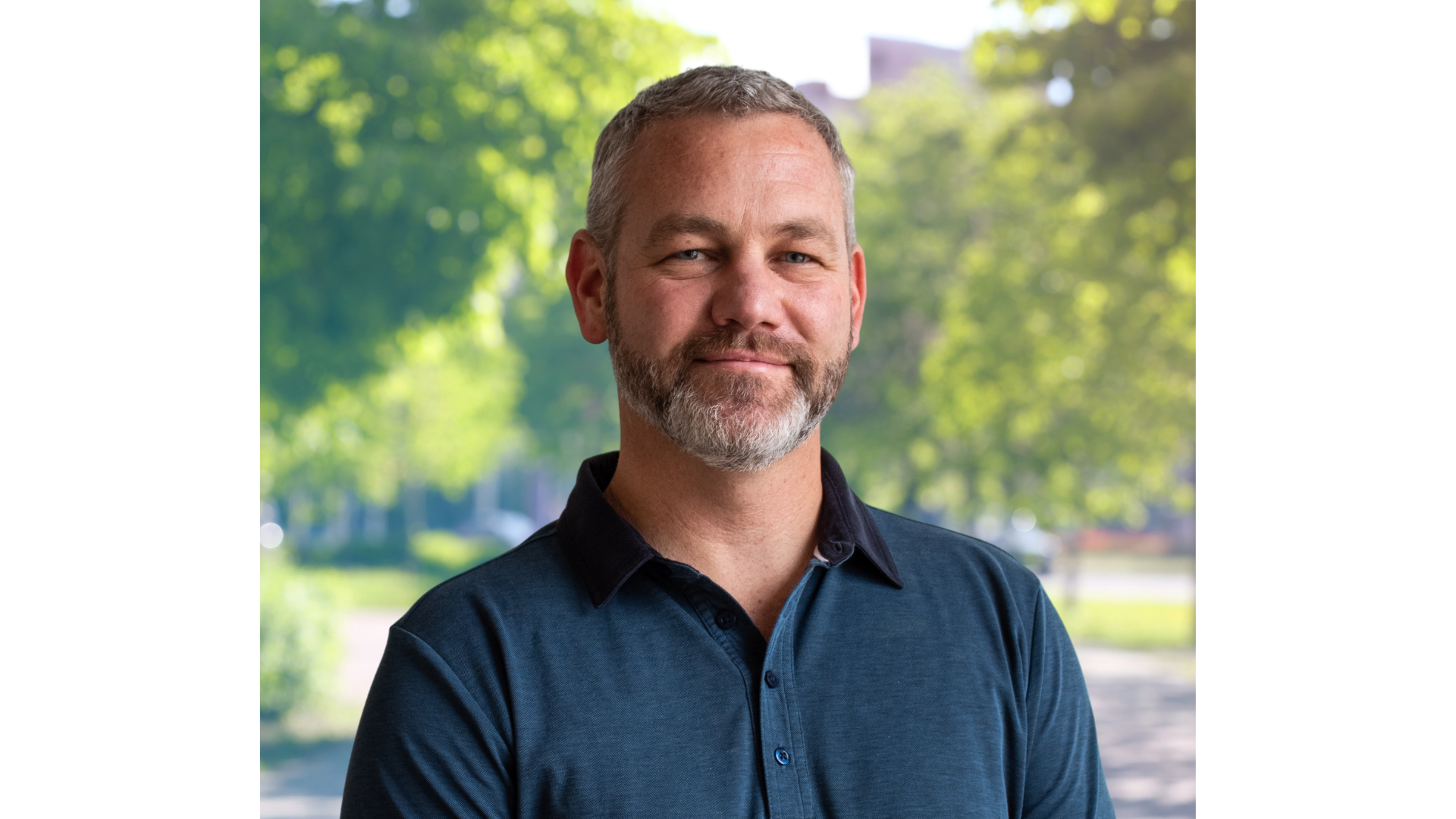 Headshot of man with graying hair and beard.